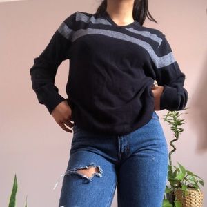 Navy blue and grey V-neck sweater